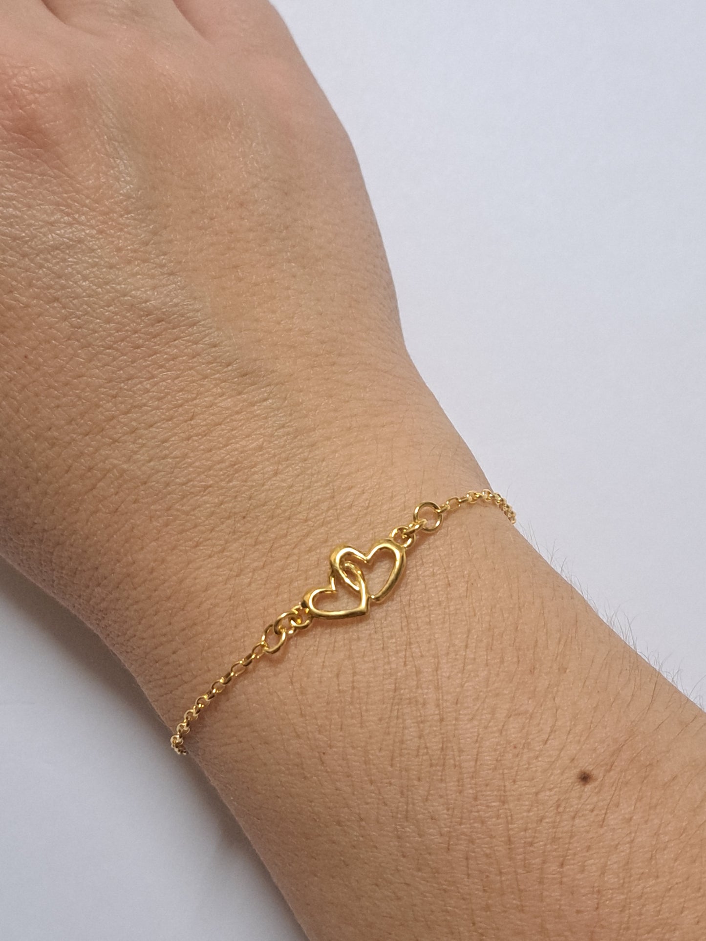 Bracelet double coeurs en argent doré à l'or 24k. Site de bijoux. France
